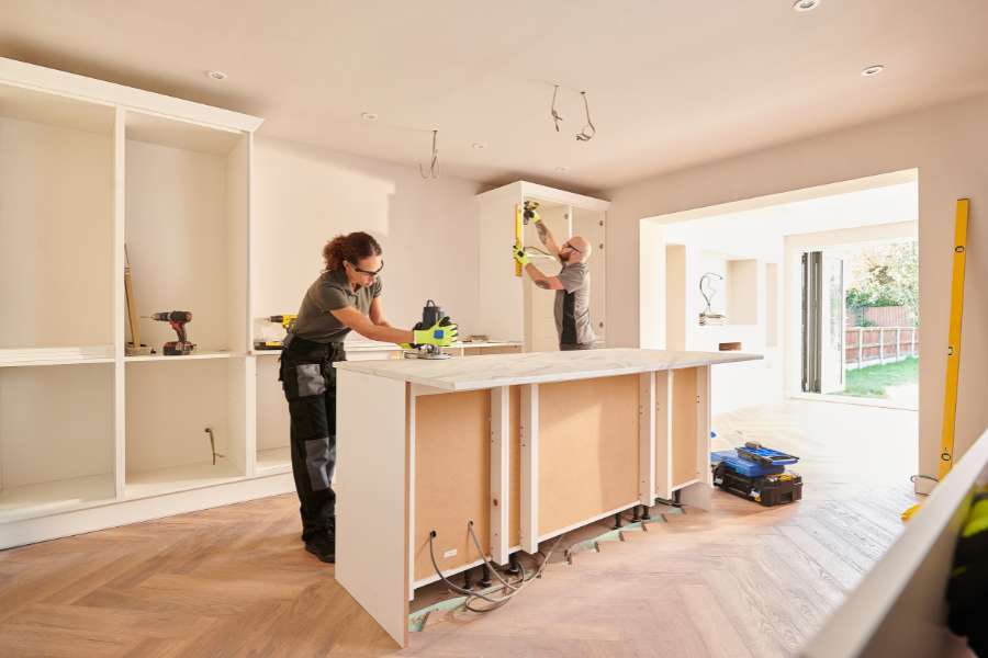  Kitchen island installation work in progress showing cabinet framework and construction phase