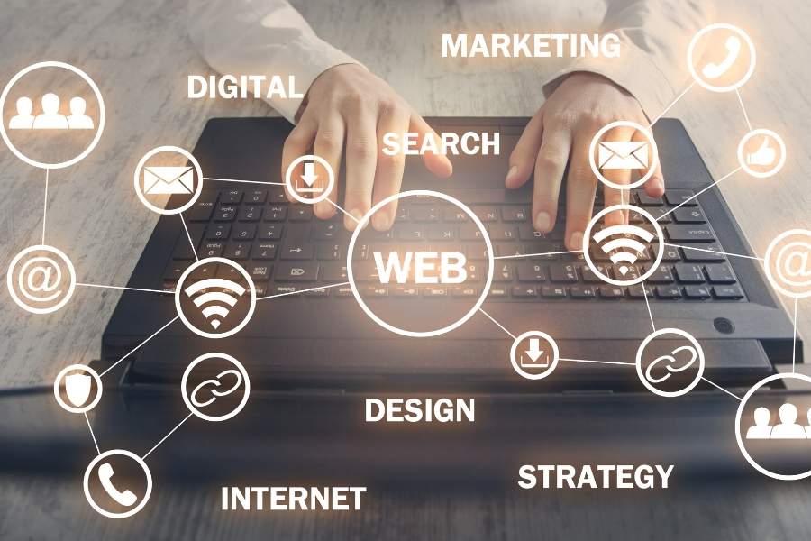 Hands typing on a laptop with various web-related icons, symbolizing the concepts behind Web3 Explained and digital transformation.